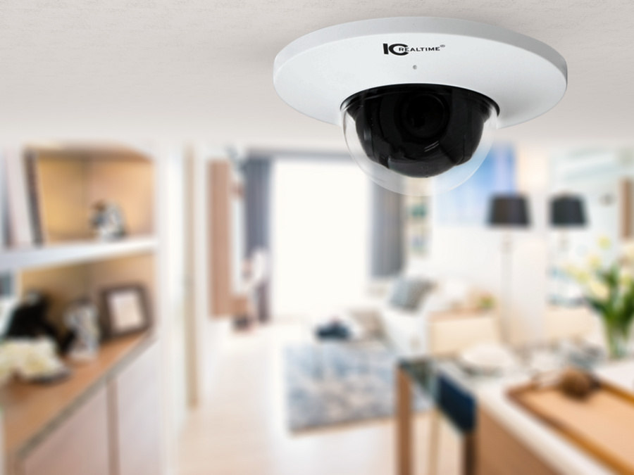 IC Realtime security dome camera installed on the ceiling in a modern living room. 