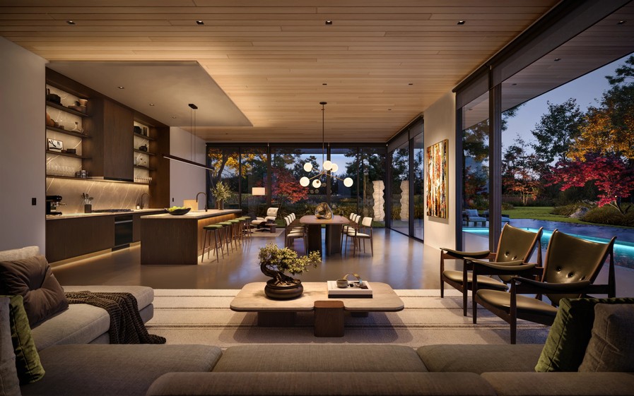Modern open-concept living space with warm architectural lighting, floor-to-ceiling windows, and a view of a landscaped backyard and pool.