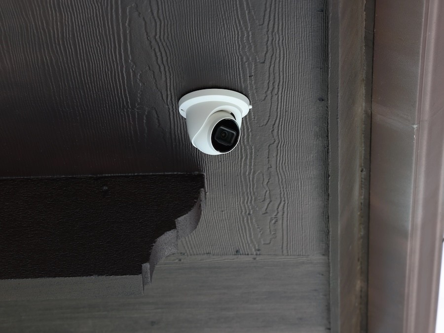 dome security camera mounted on a patio ceiling