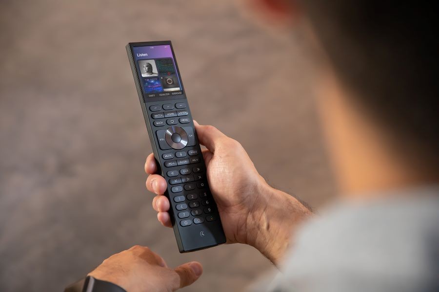 A person holding Control4’s new Halo Touch remote.