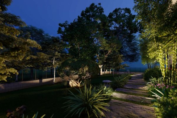 A nighttime garden scene showcasing trees illuminated by lights, offering a serene and enchanting environment.